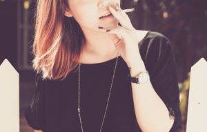 woman smoking cigarette