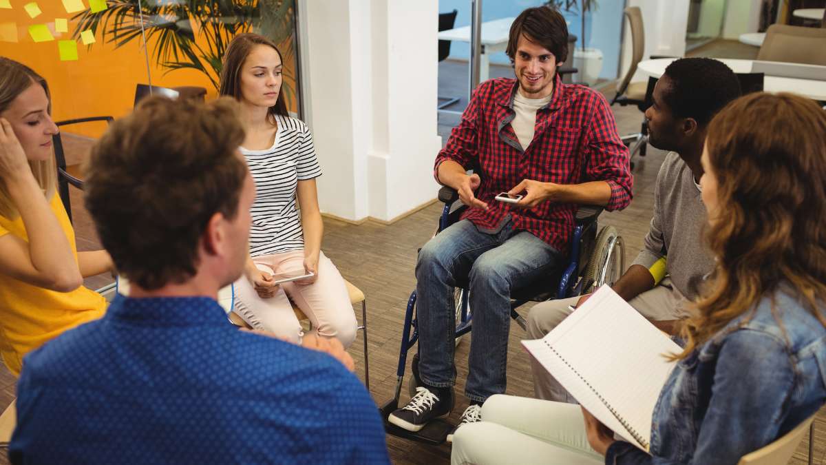 Individuals engaging in group therapy as part of residential treatment holistic approach.