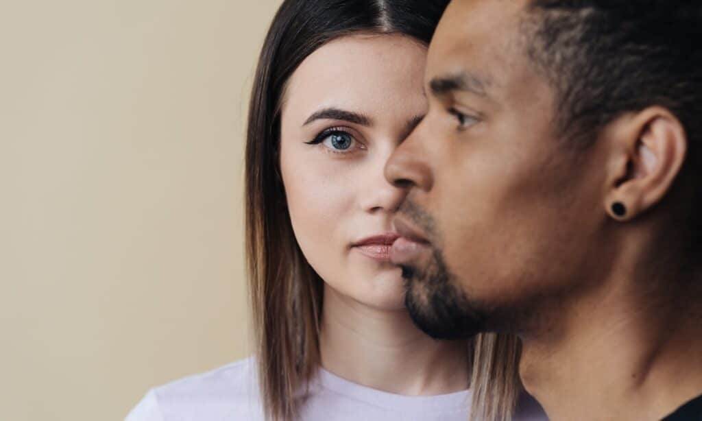 Serious-faced man and woman, representing the discussion on how eating disorders affect men and women differently.